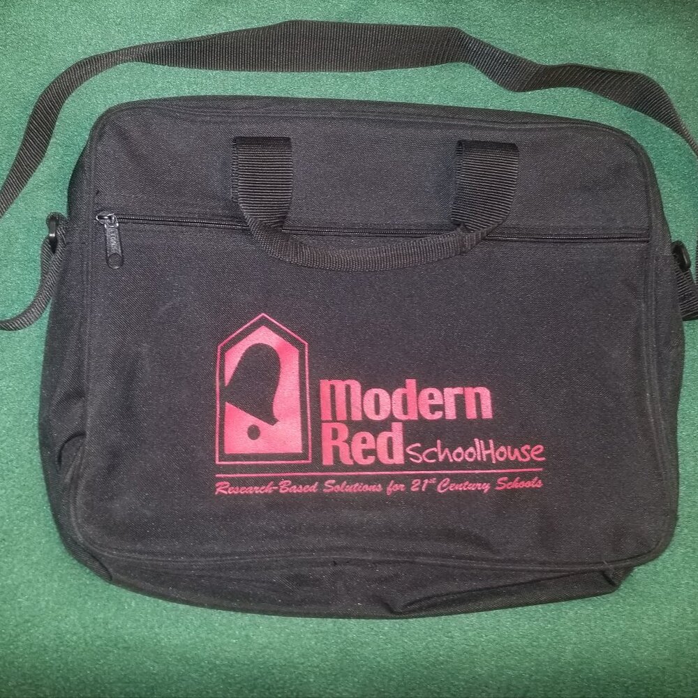 large black bag with straps, and ink-stained interior